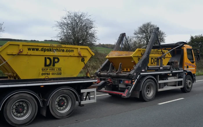DP Group branded skip on a trailer